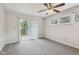 Carpeted bedroom featuring sliding glass doors leading to outdoor at 3430 Whalen Ave, Indianapolis, IN 46227