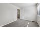 Bright bedroom featuring plush carpet, neutral walls, and a door to the hallway at 3430 Whalen Ave, Indianapolis, IN 46227