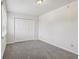 Well-lit bedroom featuring plush carpet, neutral walls, and a double door closet at 3430 Whalen Ave, Indianapolis, IN 46227