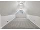 Finished bonus room provides extra living space with new carpet and a window at 3430 Whalen Ave, Indianapolis, IN 46227