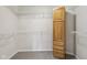 Spacious walk-in closet with wire shelving and a built-in wooden cabinet at 3430 Whalen Ave, Indianapolis, IN 46227