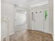 Bright foyer with tile floor, transom window over front door, and view into spacious living area at 3430 Whalen Ave, Indianapolis, IN 46227