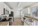 Well-lit kitchen with stainless steel appliances and granite countertops at 3430 Whalen Ave, Indianapolis, IN 46227