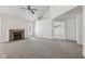 Large living room with neutral carpet, vaulted ceilings, fireplace, and view of loft area at 3430 Whalen Ave, Indianapolis, IN 46227