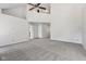 Open concept living area featuring neutral carpet, vaulted ceilings, and lots of natural light at 3430 Whalen Ave, Indianapolis, IN 46227