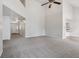 Bright and airy living area with neutral carpet, open floor plan, and a view to the home entrance at 3430 Whalen Ave, Indianapolis, IN 46227