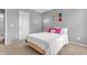 Comfortable bedroom featuring a light wood bedframe and accents, complemented by a modern-style area rug at 3637 Newberry Rd, Plainfield, IN 46168