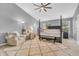 Beautiful bedroom with four-poster bed, plush rug, sitting area, and plenty of natural light at 3637 Newberry Rd, Plainfield, IN 46168