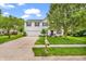 Inviting two-story home with a well-maintained lawn and a classic mailbox near the sidewalk at 3637 Newberry Rd, Plainfield, IN 46168