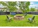 Cozy backyard fire pit area with seating, perfect for outdoor gatherings and relaxation at 3637 Newberry Rd, Plainfield, IN 46168