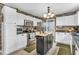 Well-lit kitchen with white cabinets, stainless steel appliances, and a central island at 3637 Newberry Rd, Plainfield, IN 46168
