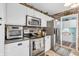 Spacious kitchen with stainless steel appliances and white cabinetry at 3637 Newberry Rd, Plainfield, IN 46168