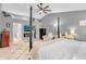 Spacious main bedroom with vaulted ceiling, fireplace, walk-in closet, and an elegant four-poster bed at 3637 Newberry Rd, Plainfield, IN 46168