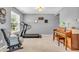 Cozy recreation room with carpet, treadmill, piano and a comfortable chair at 3637 Newberry Rd, Plainfield, IN 46168