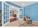 Sitting room with French doors, a chair, an ottoman, and view to the Foyer at 3637 Newberry Rd, Plainfield, IN 46168