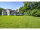 Inviting backyard featuring a spacious deck and a lush green lawn, perfect for outdoor gatherings at 3816 Cologne Ct, Indianapolis, IN 46228