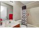 Bathroom featuring a single sink vanity and a bathtub with shower at 3816 Cologne Ct, Indianapolis, IN 46228