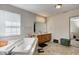 Bathroom features a soaking tub, double sink vanity, and large mirror at 3816 Cologne Ct, Indianapolis, IN 46228