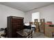This bedroom features a dark wood dresser and boxes at 3816 Cologne Ct, Indianapolis, IN 46228