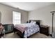 Carpeted bedroom with a window and a bed with blue covers at 3816 Cologne Ct, Indianapolis, IN 46228