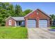Charming brick home with a two-car garage and well-maintained front lawn, exuding curb appeal at 3816 Cologne Ct, Indianapolis, IN 46228