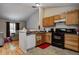 Functional kitchen featuring appliances and direct view to the living room at 3816 Cologne Ct, Indianapolis, IN 46228