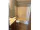 Cozy bathroom featuring a vanity with a sink, a toilet, and a shower-tub combo with a neutral-toned surround at 39 Meadow Creek East Blvd, Whiteland, IN 46184