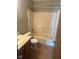 Cozy bathroom featuring a vanity with a sink, a toilet, and a shower-tub combo with a neutral-toned surround at 39 Meadow Creek East Blvd, Whiteland, IN 46184