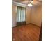 Comfortable bedroom with neutral walls, laminate flooring, a ceiling fan, and a window with privacy curtains at 39 Meadow Creek East Blvd, Whiteland, IN 46184