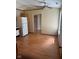 Dining area with overhead fan and light fixture, refrigerator, and laminate flooring at 39 Meadow Creek East Blvd, Whiteland, IN 46184