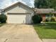 Ranch home featuring a two car garage, neutral siding, and brick accents at 39 Meadow Creek East Blvd, Whiteland, IN 46184