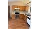Kitchen with wood cabinets, stainless steel range, dishwasher, and white countertops at 39 Meadow Creek East Blvd, Whiteland, IN 46184
