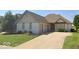 Charming single-Gathering home with a two-car garage, well-maintained lawn and mature trees at 4230 Raintree Blvd, Greenwood, IN 46143