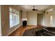 Bright living room with a fireplace, hardwood floors, and large windows providing lots of natural light at 4230 Raintree Blvd, Greenwood, IN 46143