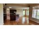 Spacious living room featuring hardwood floors and ample natural light from large windows at 4230 Raintree Blvd, Greenwood, IN 46143