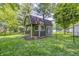 Backyard shed featuring a wooden porch swing and dual entry doors at 436 N 500 W, Anderson, IN 46011