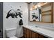 Bathroom features a sink, mirror, toilet, and wall art at 436 N 500 W, Anderson, IN 46011