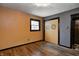 Bedroom features a hardwood floor and closet doors with sun art at 436 N 500 W, Anderson, IN 46011