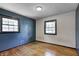 Bedroom features a hardwood floor and two windows at 436 N 500 W, Anderson, IN 46011