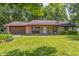 Charming single-story brick home with a well-manicured lawn and an attached garage at 436 N 500 W, Anderson, IN 46011