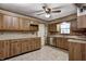 Bright kitchen featuring wood cabinetry, light countertops, and modern stainless steel appliances at 436 N 500 W, Anderson, IN 46011