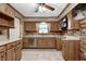Updated kitchen featuring wood cabinets, tile flooring, and modern stainless steel appliances at 436 N 500 W, Anderson, IN 46011