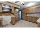 Well-equipped kitchen with wood cabinetry, tile flooring, and a convenient microwave at 436 N 500 W, Anderson, IN 46011
