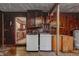 Laundry room featuring modern washer and dryer units with wood paneled walls at 436 N 500 W, Anderson, IN 46011