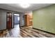Inviting living room with stylish wood-look floors and warm, neutral-toned walls at 436 N 500 W, Anderson, IN 46011