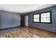 Comfortable living room with hardwood flooring and abundant natural light from a large window at 436 N 500 W, Anderson, IN 46011