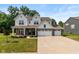 Charming two-story home boasts a three-car garage, brick accents, and a well-manicured lawn at 4642 Boyd Pl, Westfield, IN 46062