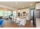 Open-concept kitchen boasts a large island, barstool seating, and stainless-steel appliances at 4642 Boyd Pl, Westfield, IN 46062