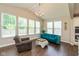 Bright and airy living room with vaulted ceilings, large windows, and stylish modern furniture at 4642 Boyd Pl, Westfield, IN 46062