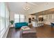 Bright living room features vaulted ceilings, large windows, and an open layout leading to the kitchen at 4642 Boyd Pl, Westfield, IN 46062